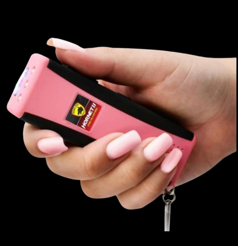 Pink stun gun with flashlight and alarm